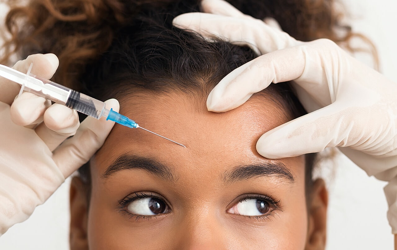 Tucson Botox model receiving a cosmetic injection treatment.