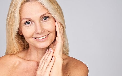 Tucson Juvederm model with long blonde hair, natural beauty.