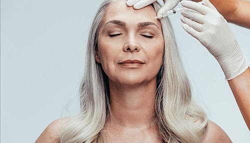 Tucson Juvederm model receiving cosmetic treatment in a clinic.
