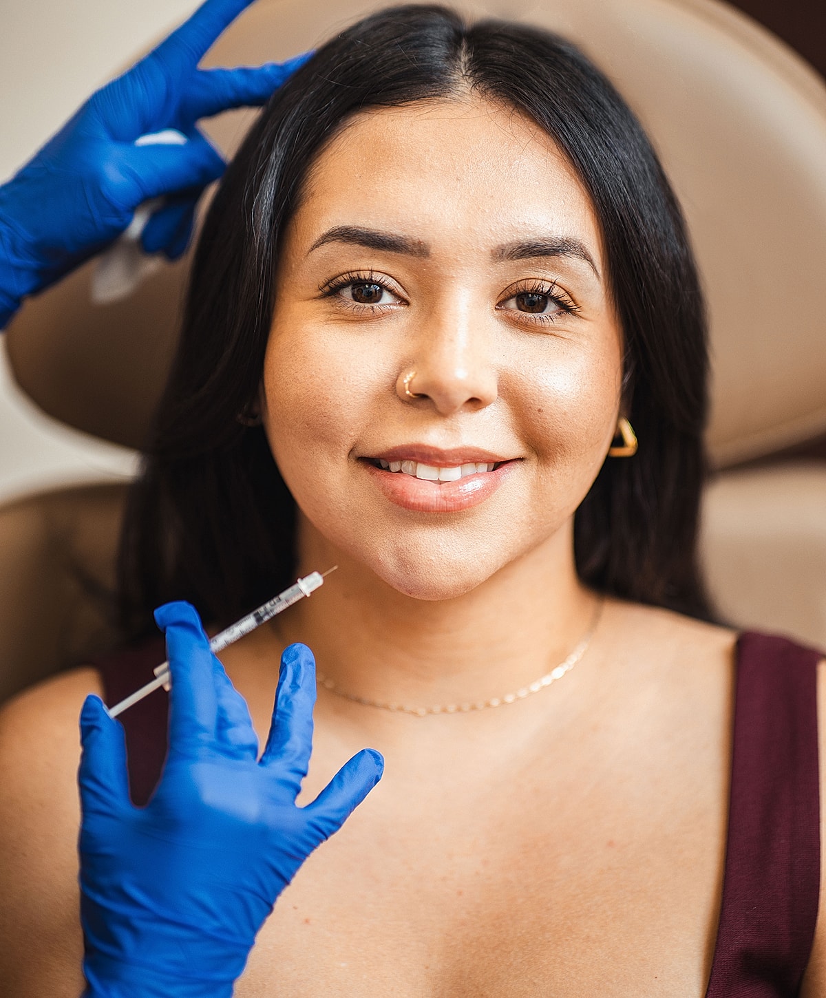 Tucson Restylane model receiving cosmetic treatment with syringe.