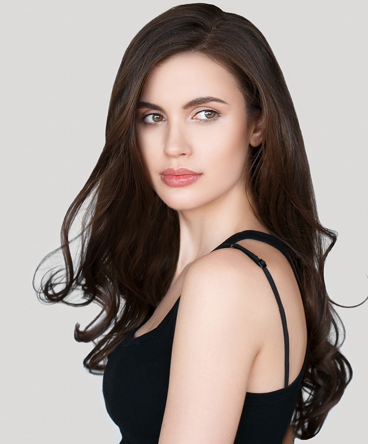 Tucson Juvederm model with long, wavy hair.