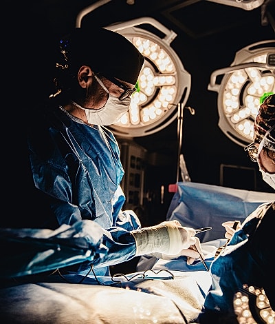 Surgeons performing an operation in an operating room.