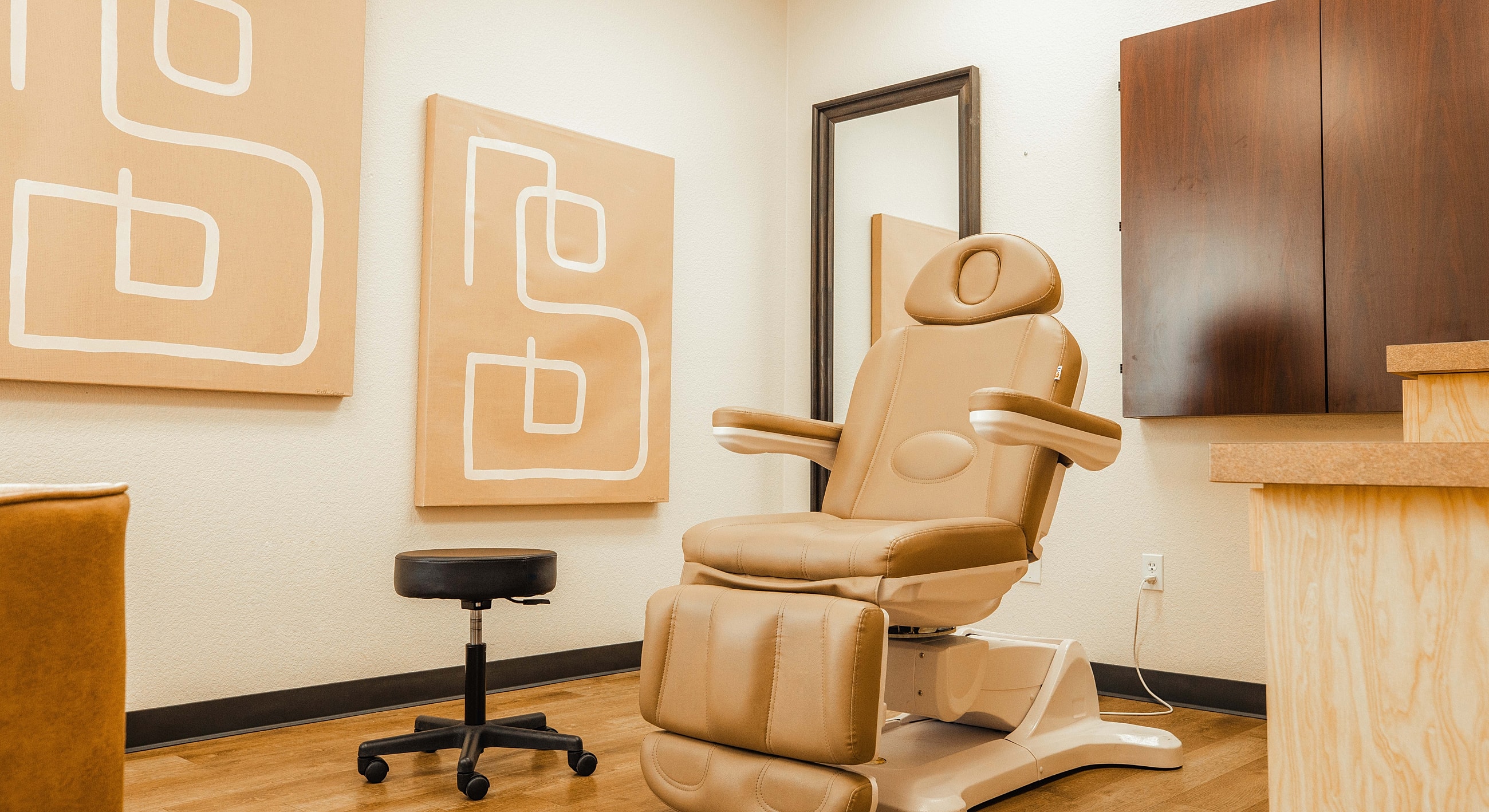 Spa treatment room with reclining chair and decor