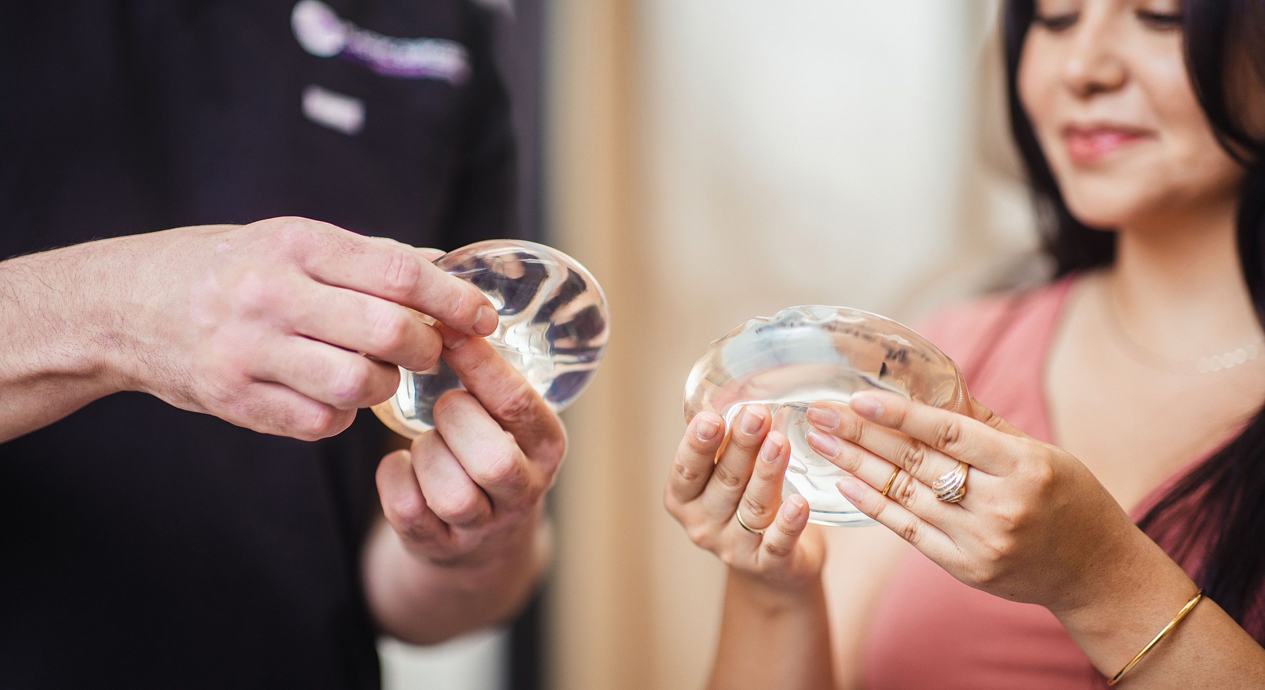 Discussing silicone breast implants in consultation setting.